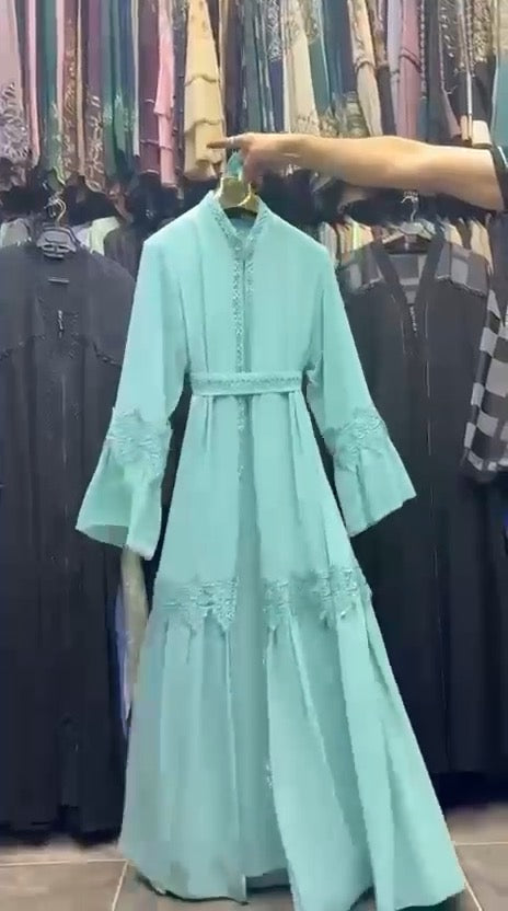 Women's mint green chiffon abaya hanging view